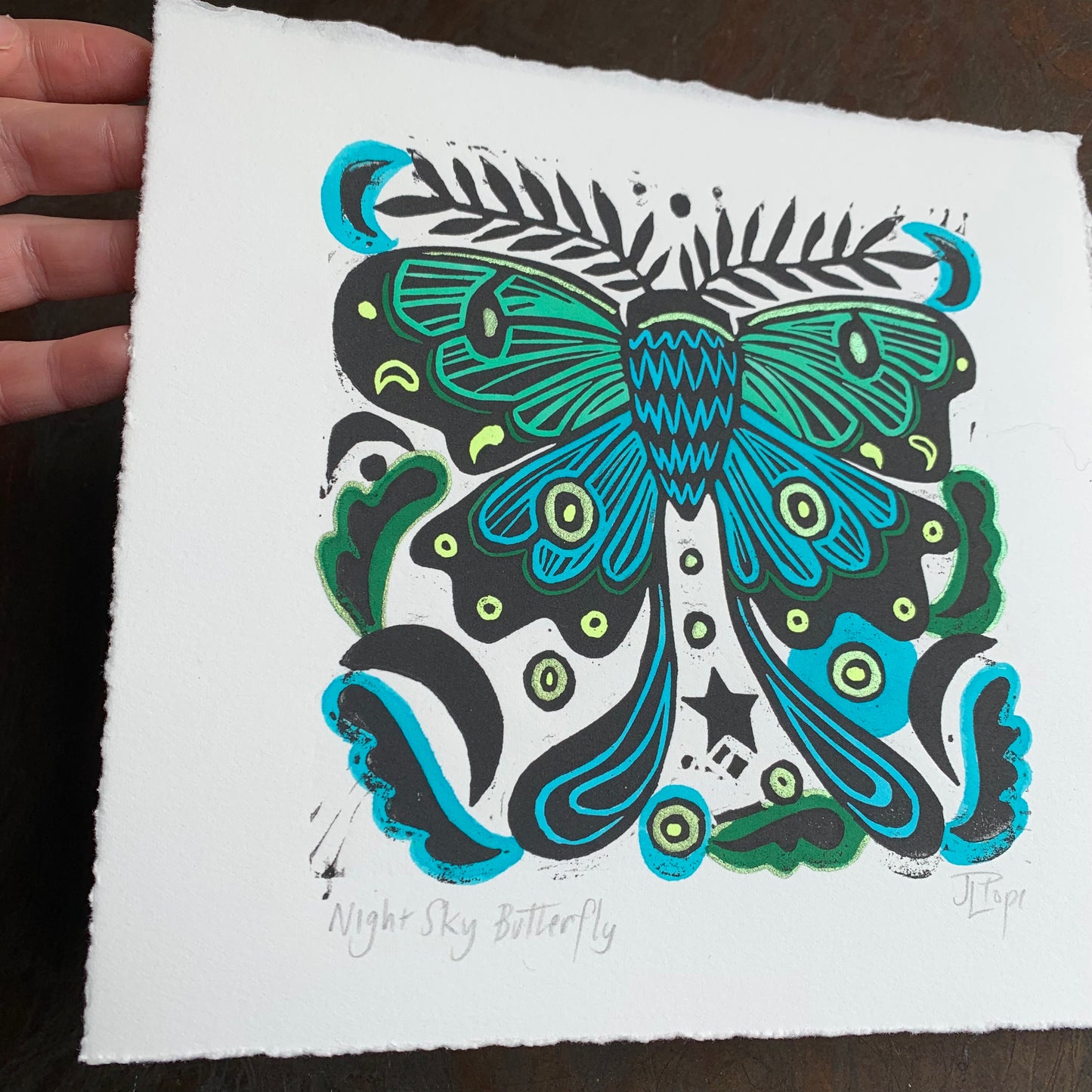 Handpainted blue moth linocut