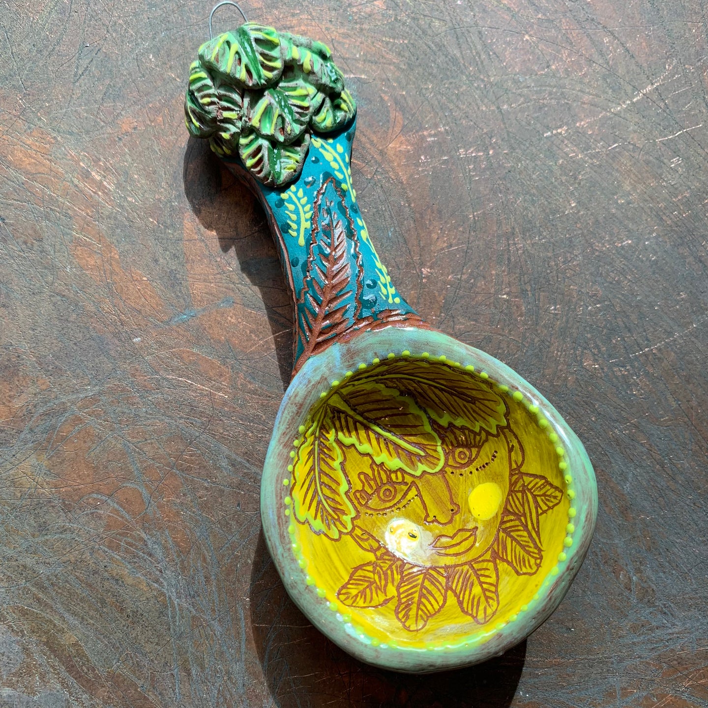 Leafy head ceramic spoon