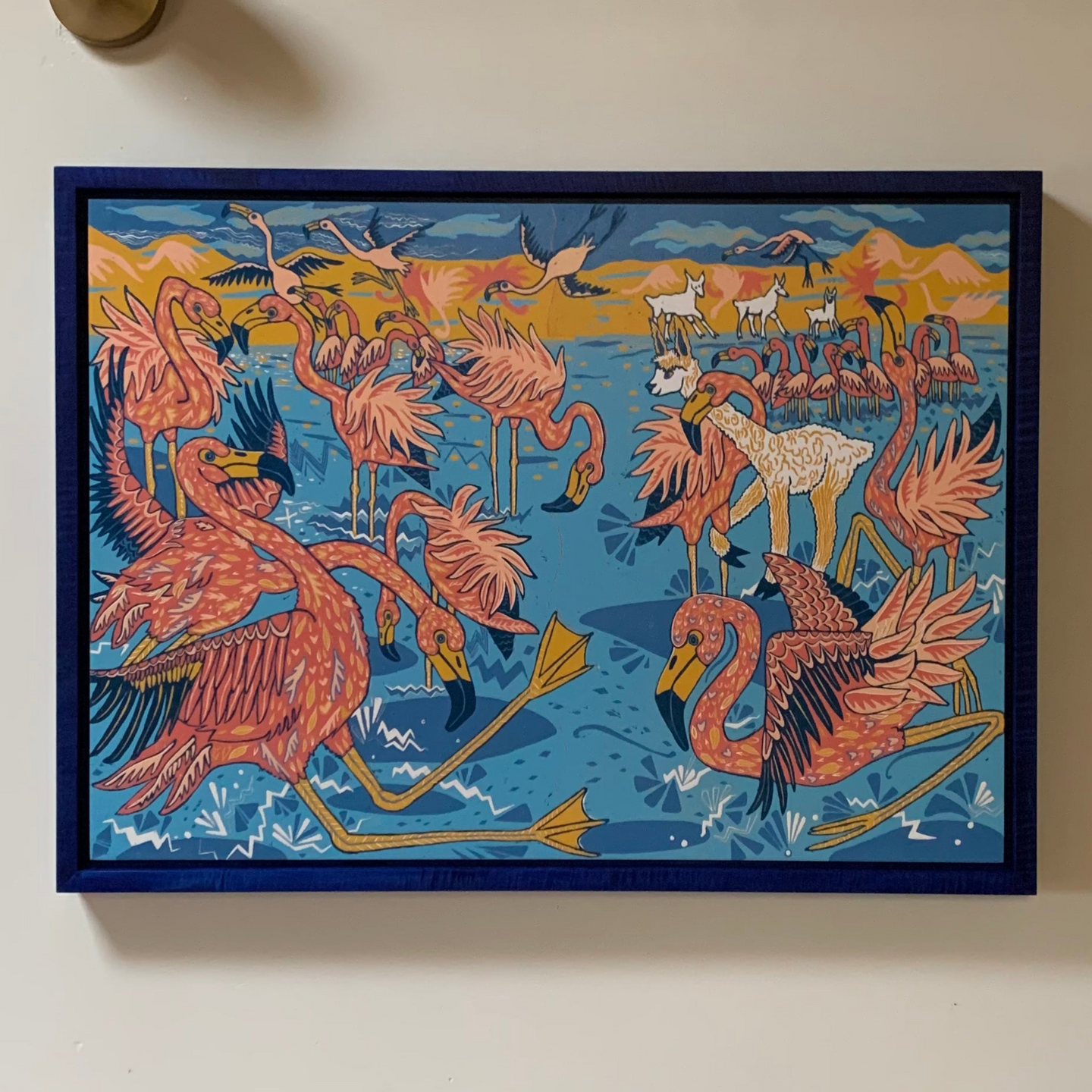 Flamingo and llama woodcut framed in blue