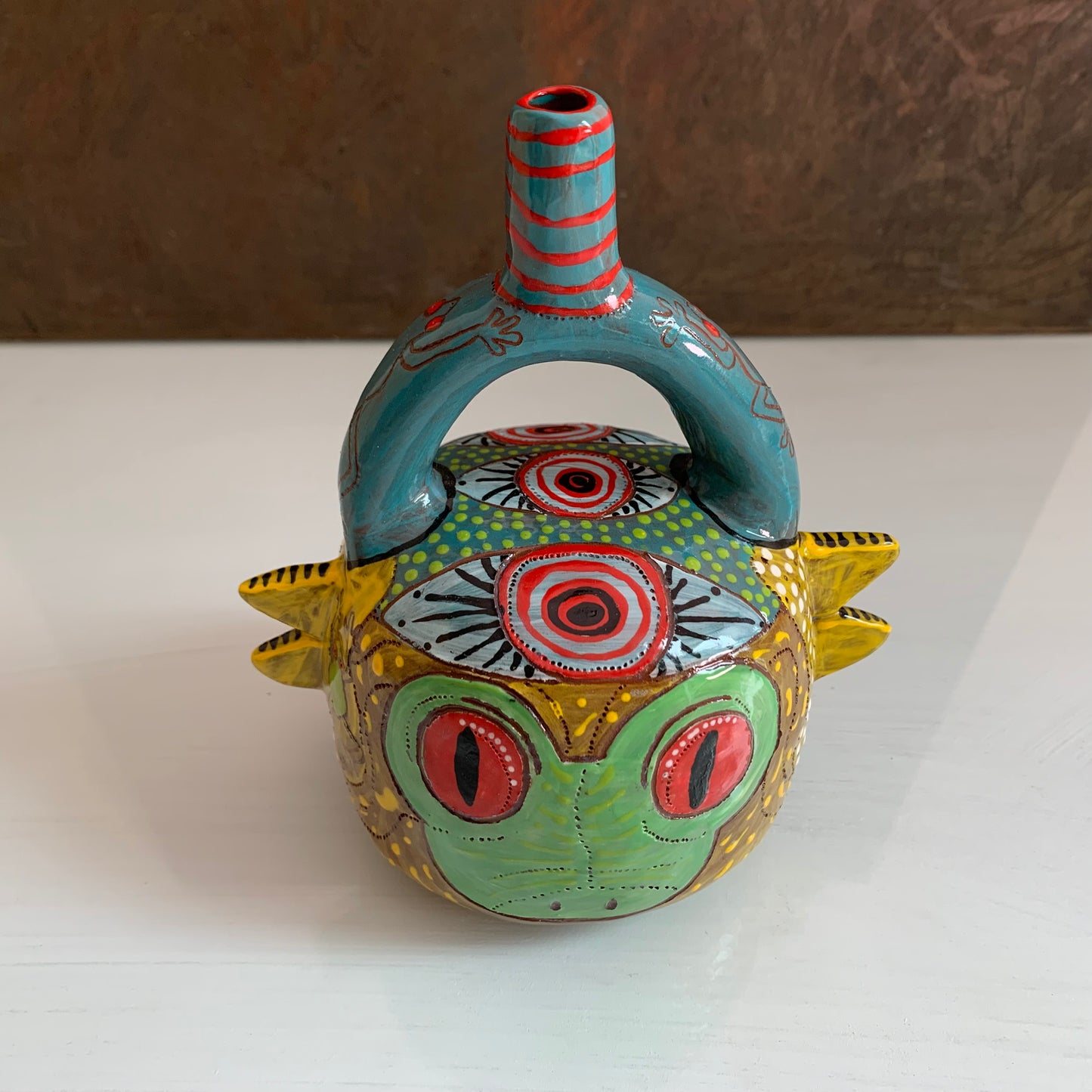 Stirrup handle frog bottle