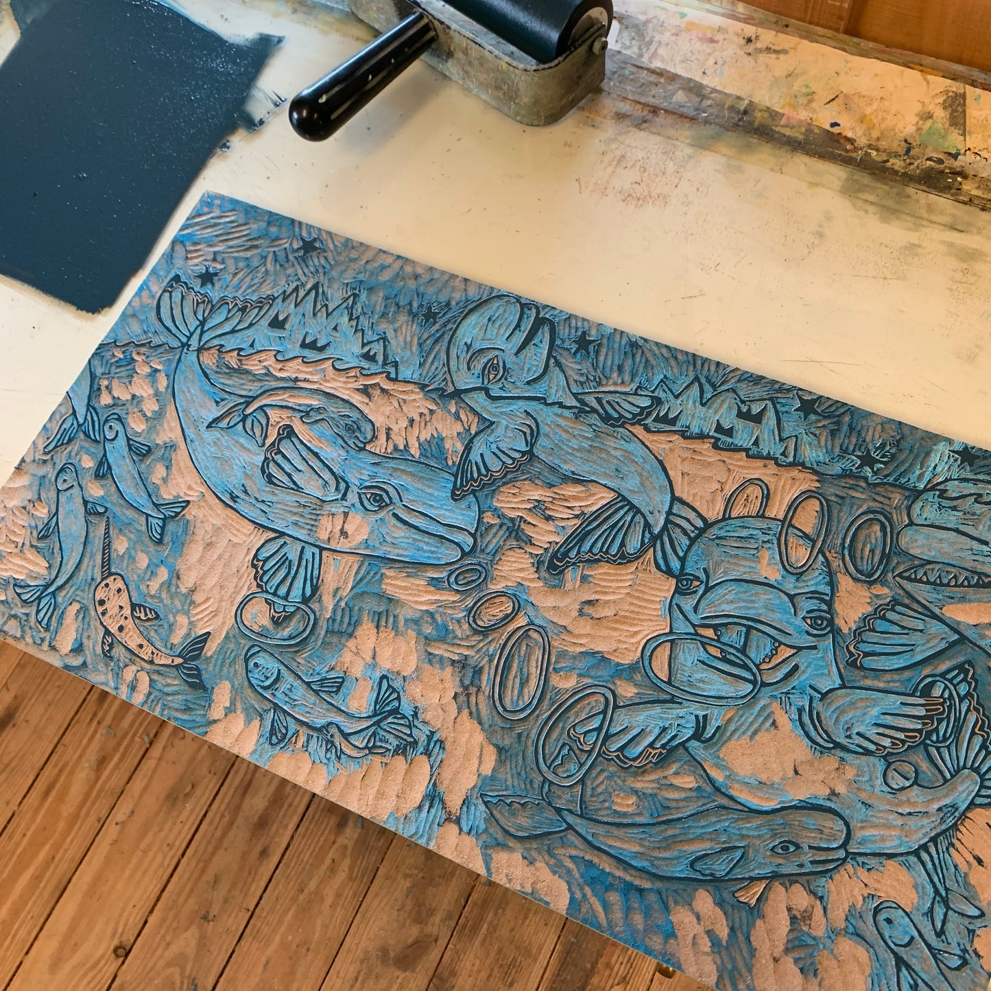 Beluga woodcut with little whales in the big whales