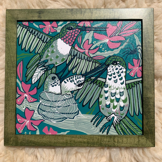 Hummingbird and spiderweb framed in green