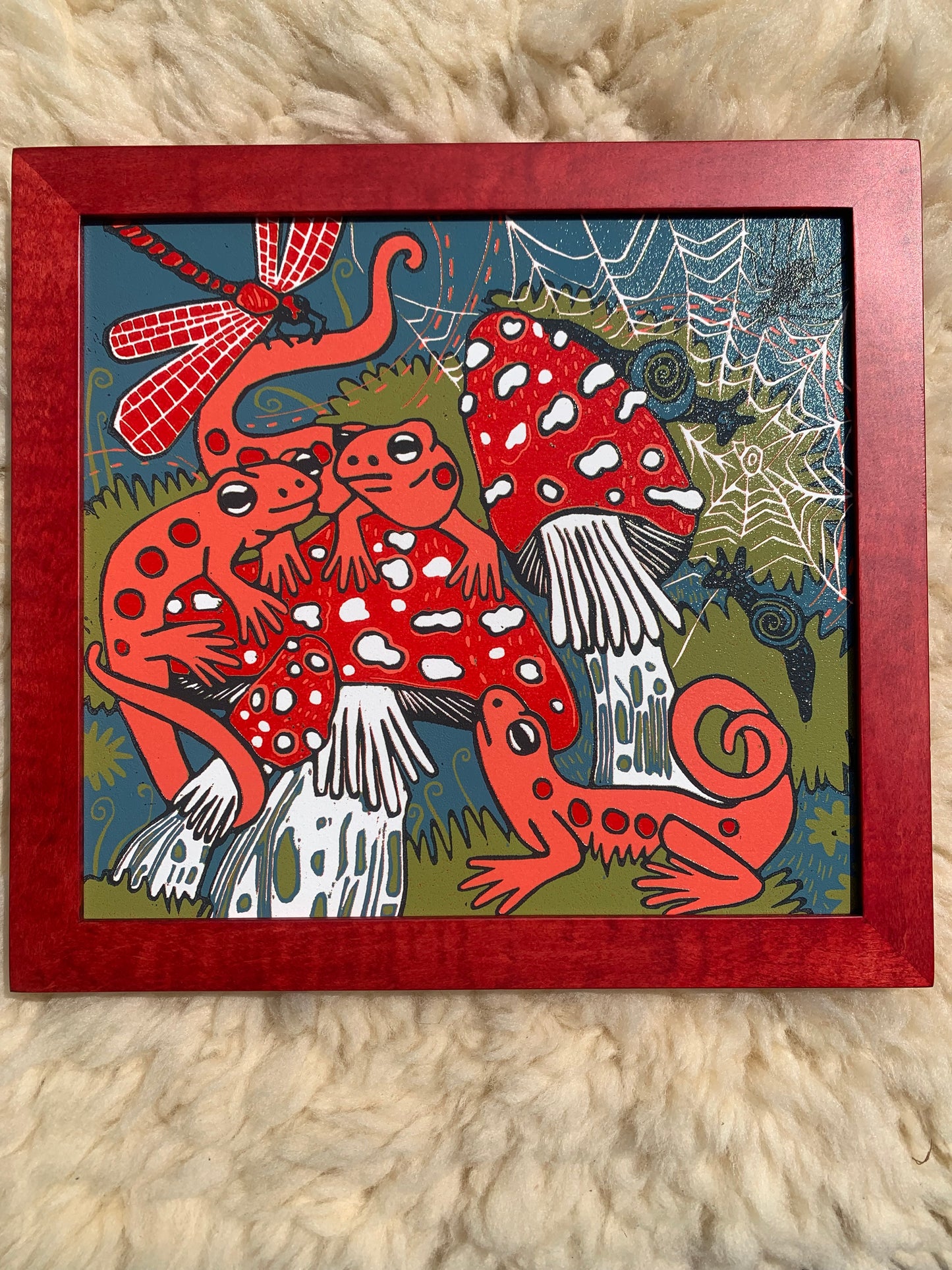 Red eft and mushroom framed in red