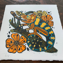 Load image into Gallery viewer, Blue and orange Handpainted chameleon linocut
