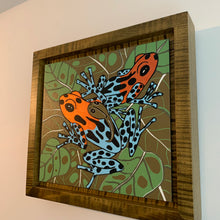 Load image into Gallery viewer, Dart frog woodcut framed in olive green solid tiger maple wood
