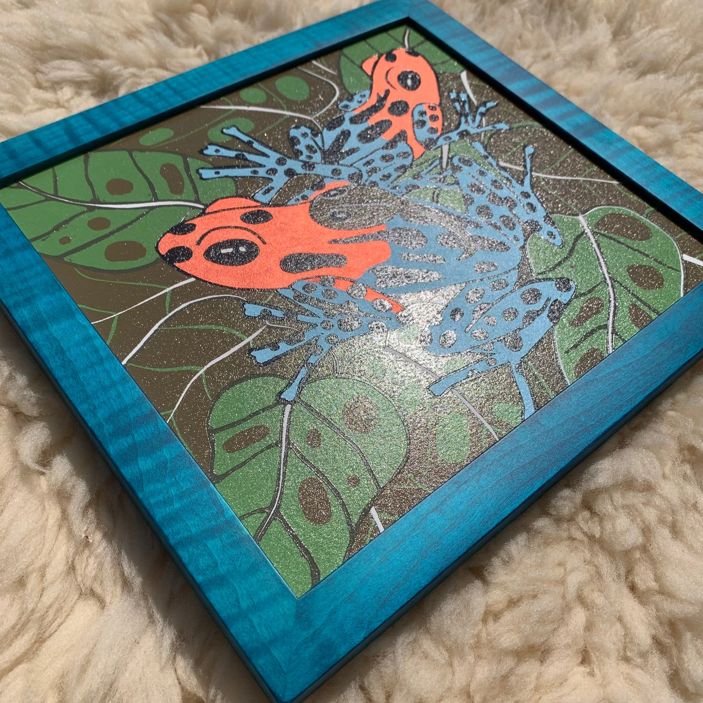 Dart frog woodcut framed in solid tiger maple wood