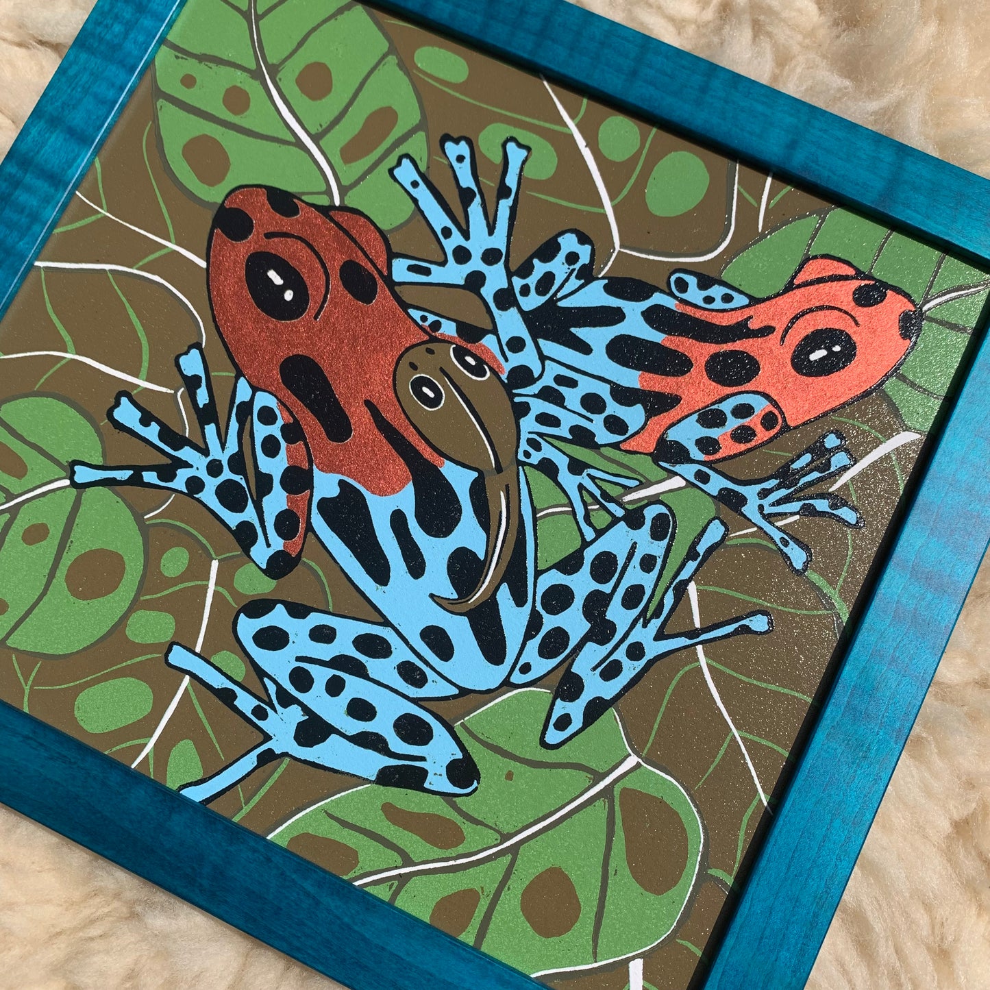 Dart frog woodcut framed in solid tiger maple wood