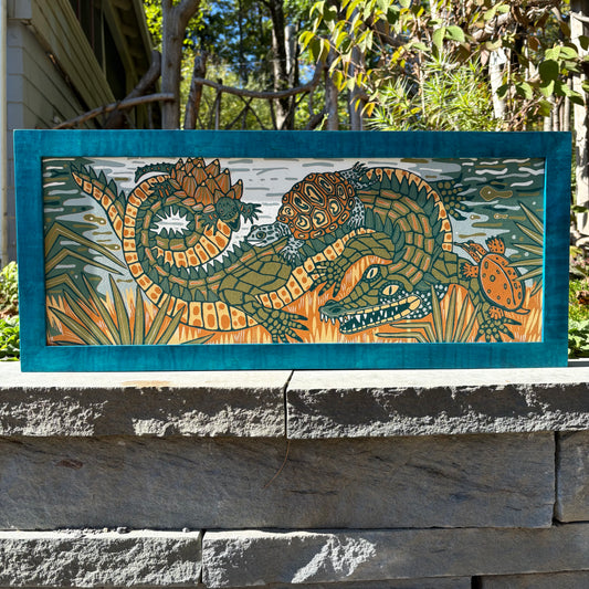 Gator and turtle woodcut framed in turquoise