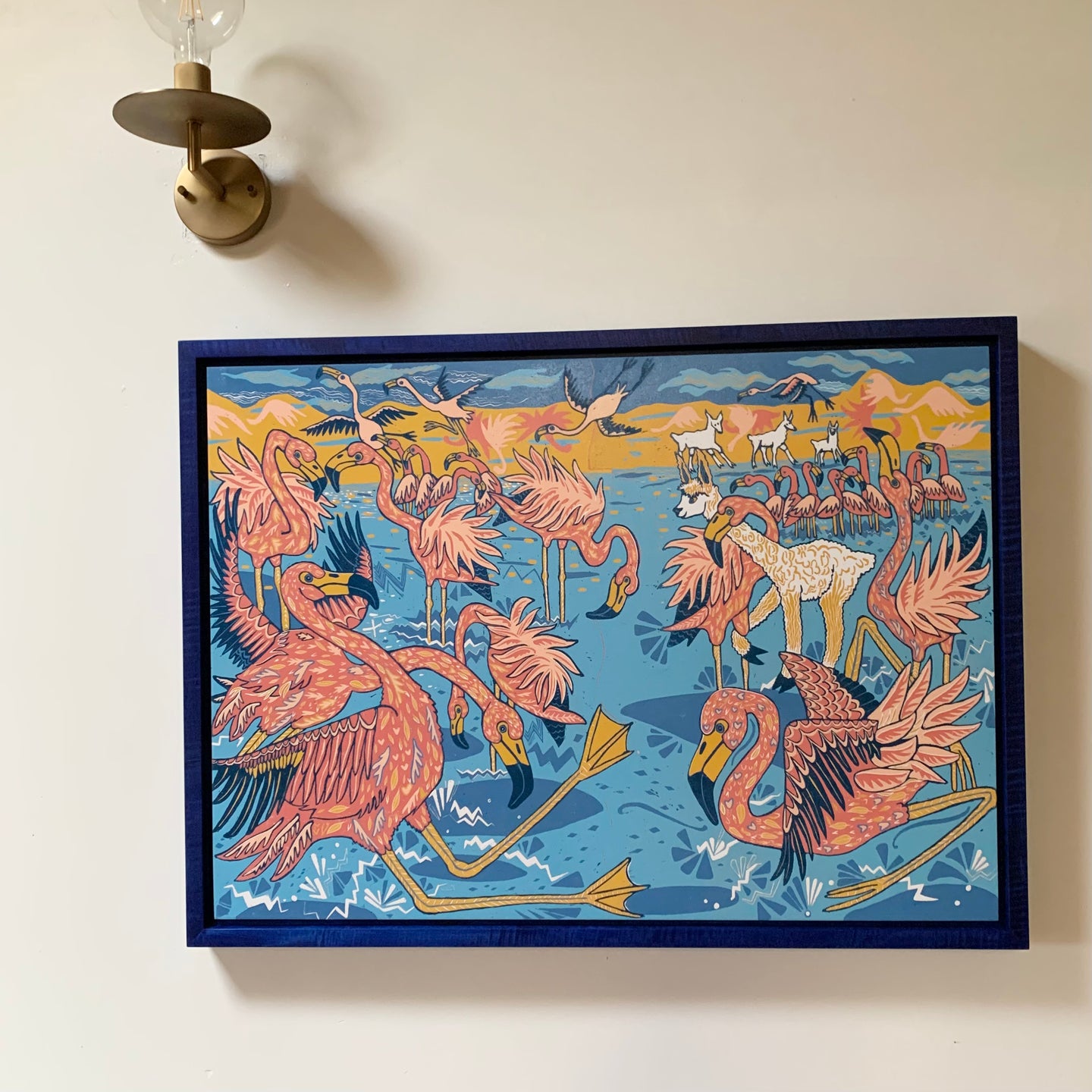 Flamingo and llama woodcut framed in blue