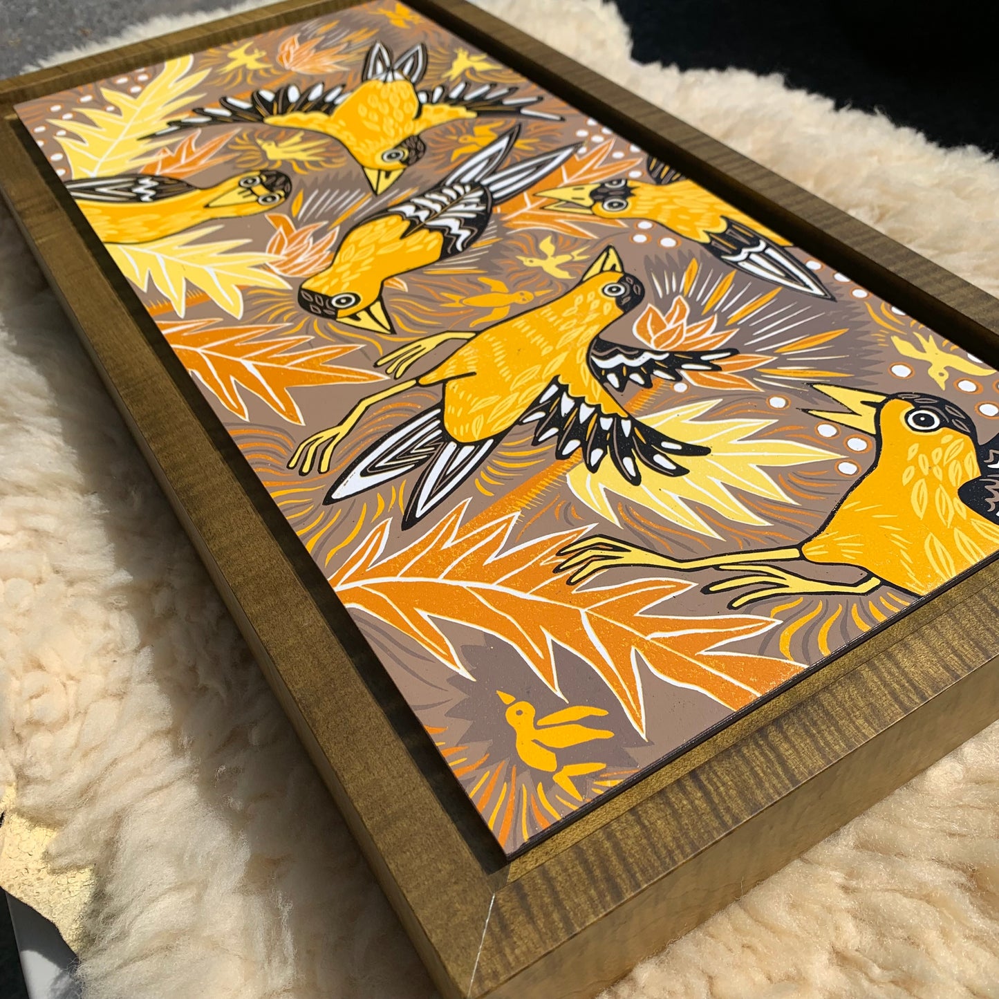 Goldfinch woodcut framed in olive curly maple
