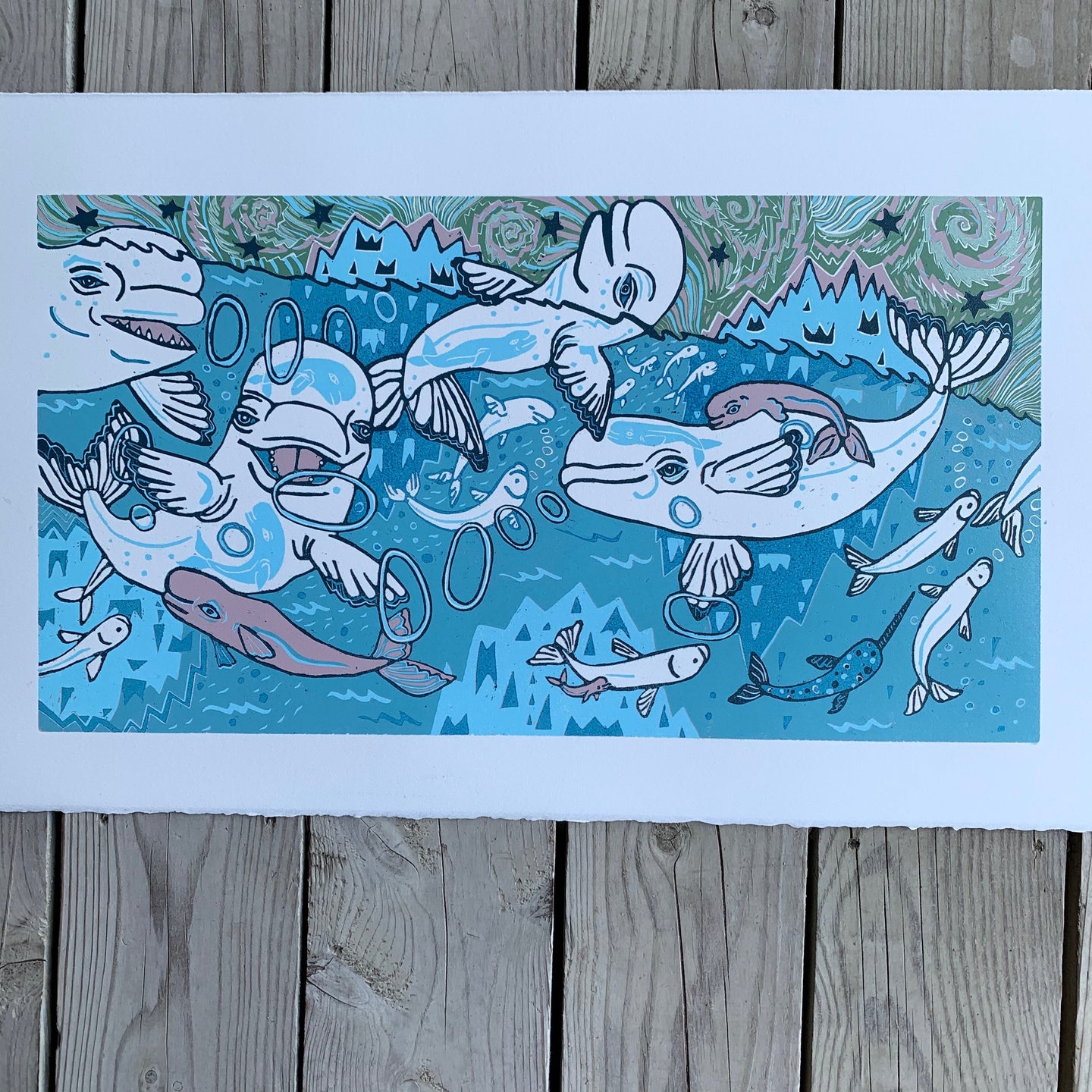 Beluga woodcut with little whales in the big whales