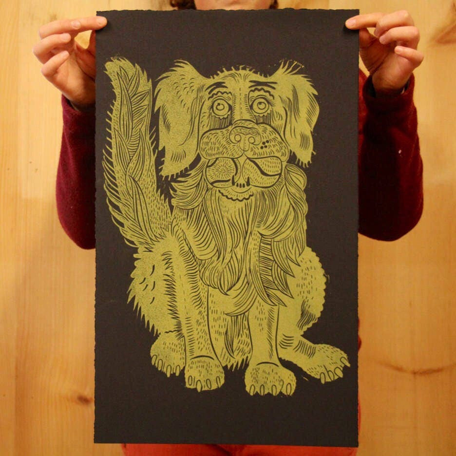 Golden retriever on black paper woodcut